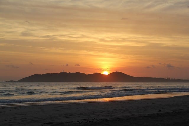 NSW clean energy: Byron Bay coast with sun rise