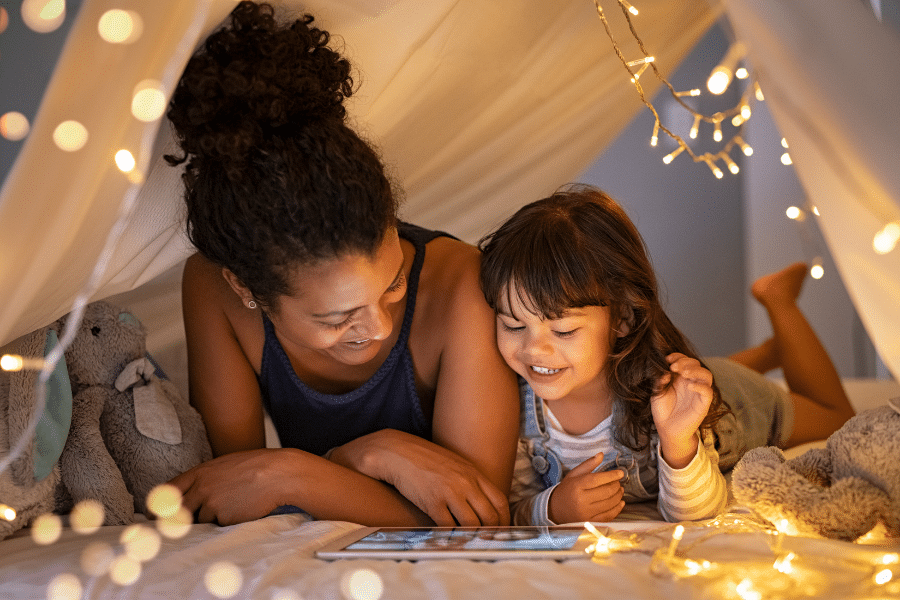 mother and daughter with fairy lights