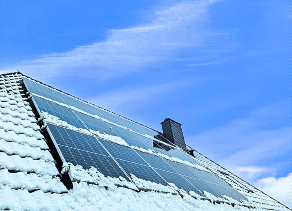 solar panels and snow on roof