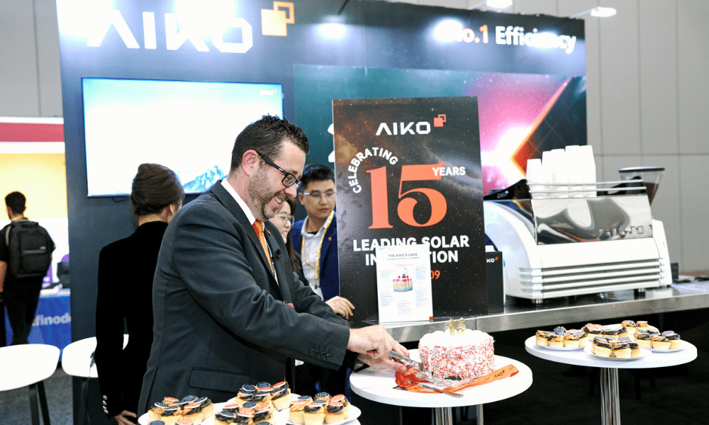 Thomas Bywater - Country Head AIKO ANZ cutting cake celebrating 15th Anniversary