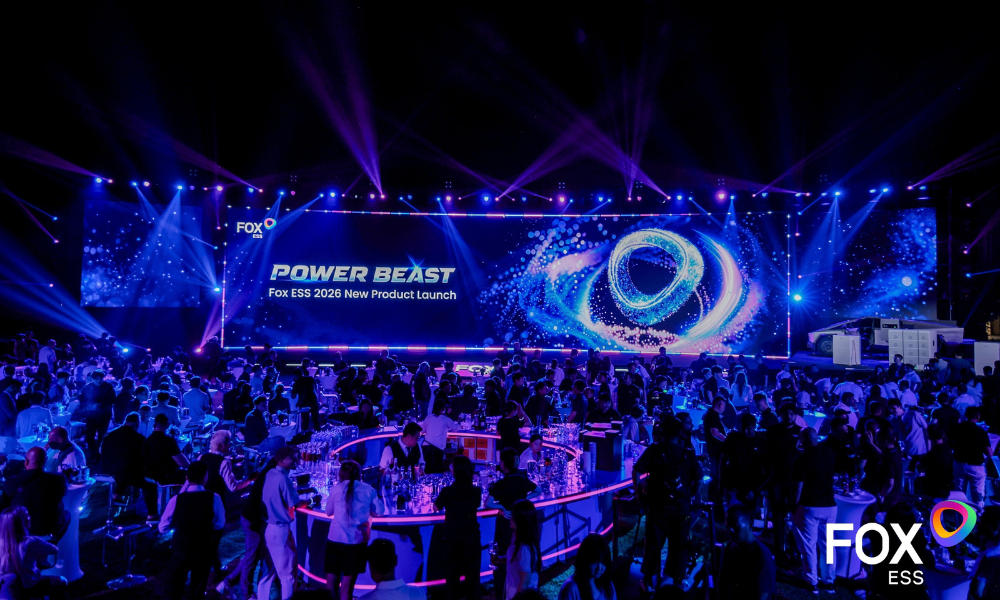 Stage at a Fox ESS event with a large digital backdrop reading 'POWER BEAST' and 'New Product Launch' amid blue lighting and lasers, crowd seated at tables in front. Stage at a Fox ESS event with a large digital backdrop reading 'POWER BEAST' and 'New Product Launch' amid blue lighting and lasers, crowd seated at tables in front.