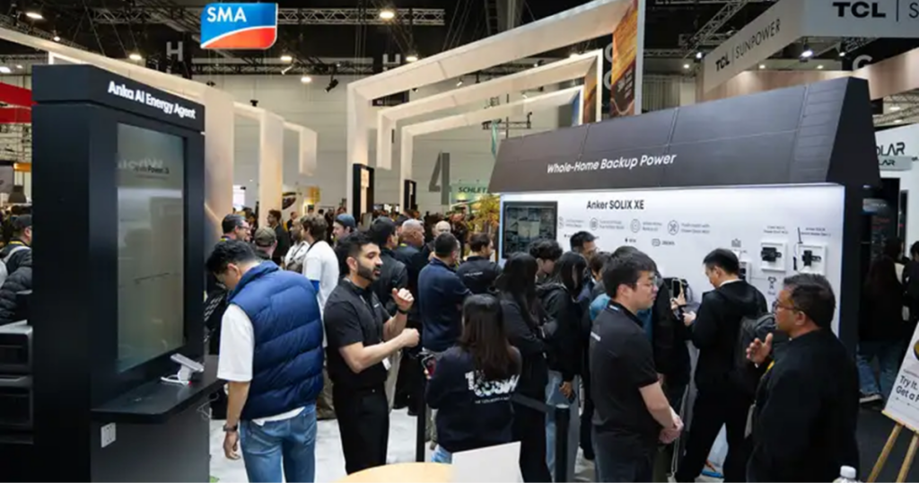 Crowded tech expo booth featuring a 'Whole-Home Backup Power' display and Anker SOLIX XE product line. Crowded tech expo booth featuring a'Whole-Home Backup Power' display and Anker SOLIX XE product line.
