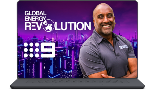 Laptop screen displaying 'Global Energy Revolution' branding with a smiling man in a gray polo against a purple city skyline.