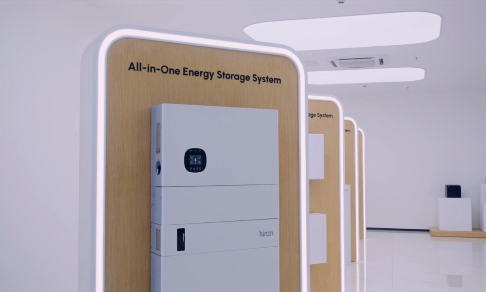 All-in-One Energy Storage System display in a bright showroom with curved wooden panels and white equipment All-in-One Energy Storage System display in a bright showroom with curved wooden panels and white equipment