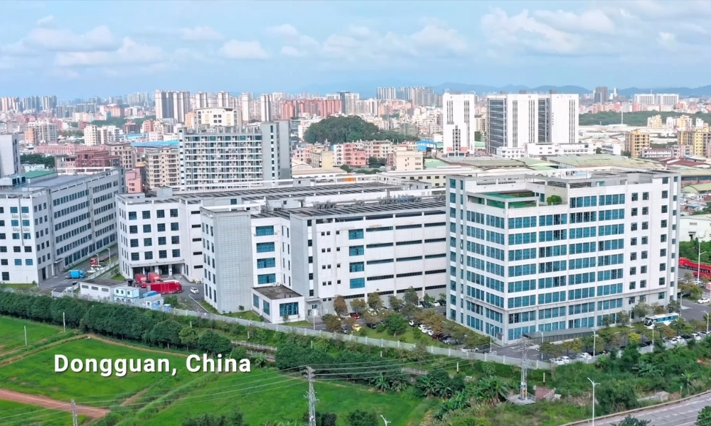 Aerial view of a modern city with numerous mid-rise buildings and green spaces in Dongguan, China. Aerial view of a modern city with numerous mid-rise buildings and green spaces in Dongguan, China.